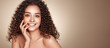 © Oleg Gekman - Fashion studio portrait of beautiful smiling woman with afro curls hairstyle. Fashion and beauty