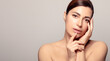 © Casther - Serene beauty: Calm and confident young adult woman with glowing, moisturized skin for rejuvenating spa treatment. With copyspace.