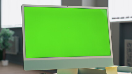Wall Mural - zoom out mockup monitor in office. close up employee talking chroma key device