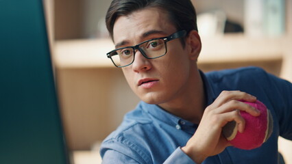 Wall Mural - Closeup businessman looking pc screen office. Guy holding ball examining project