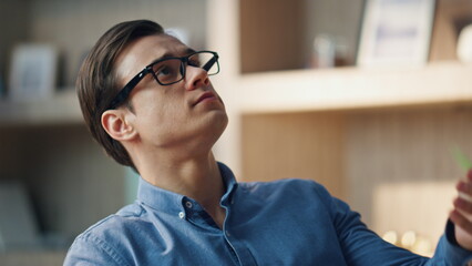Wall Mural - Resting man playing ball at office closeup. Designer taking break tossing toy