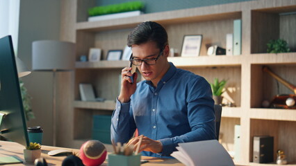 Wall Mural - Active man holding telephone call workplace. Designer typing computer keyboard