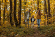 © bernardbodo - Mother, father and daughter having a walk trough the forest
