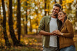 © bernardbodo - Happy, young couple in love hugging and walking in the forest