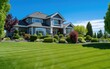 Beautiful landscaping upscale home with green grass at a  blue sky sunny day