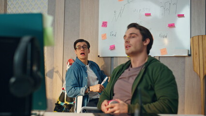 Wall Mural - Creative team video chatting online in office closeup. Two colleagues videocall