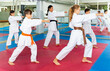 © JackF - Schoolchilds are practicing new technique by repeating for the female trainer in karate class