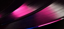 Multicolored Abstract Music Show Party Dj Background With Vinyl Disc.close-up Of Vinyl Record In Blue And Purple Glow For Background,banner.