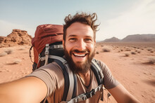 Happy Traveller Man With Backpack Taking Selfie Picture In Desert - Travel Blogger Taking Self Portrait With Smart Mobile Phone Device Outside - Life Style And Technology Concept