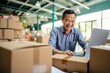 © Stavros - Online store seller during an online conversation with a buyer. A middle aged Asian man sits in a warehouse of packaged products and communicates with a customer. Preparing to send an online order.