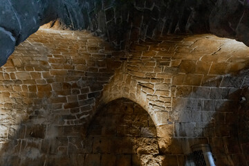 Wall Mural - Ancient masonry of walls and tunnels from the time of the Crusaders at the Templar fortress in the Acre old city in northern Israel