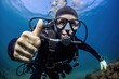 © Ева Поликарпова - A man in a diving suit giving a thumbs up. Suitable for underwater adventures or scuba diving promotions.