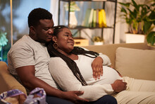 Happy Pregnant Woman And Her Husband Spending Time Together At Home