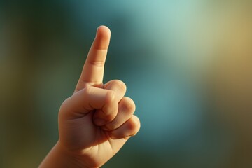 Poster - A person's hand making a peace sign with their fingers. This image can be used to represent peace, unity, and harmony.