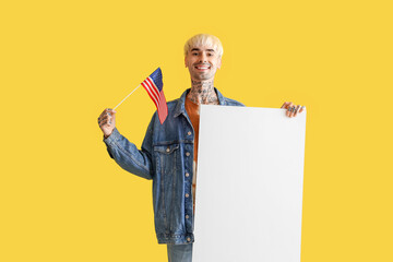 Canvas Print - Young man with USA flag and blank poster on yellow background