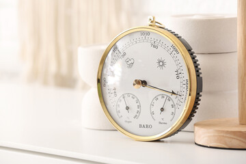 Wall Mural - Aneroid barometer on table in room, closeup