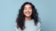 © Z A C - In a world of her own happiness, a young girl's smile takes center stage against a minimalist studio setting.