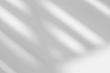 Poster - Abstract light reflection and grey shadow from window on white wall background. Gray stripe window shadows and sunshine diagonal geometric overlay effect for backdrop and mockup design