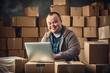 © volga - One young caucasian man with down syndrome is sitting in a room with boxes and working on a laptop. World genetic diseases day and syndrome down concept.
