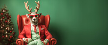 Trendy Christmas Rudolph Deer With Sunglasses And Business Suit Sitting Like A Boss In Chair. Creative Animal Concept Banner. Pastel Teal Green Background.