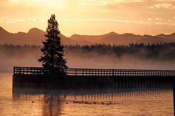 Wall Mural - Sunrise in Yellowstone lake in September 