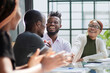 © Katsiaryna - Smiling african american man shaking hands with a business partner at a meeting, greeting, getting to know