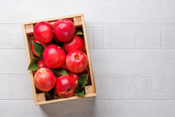 Wall Mural - Wooden box with fresh red apples