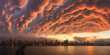 Mammatus clouds over a city near the sea. Extreme weather and climate change concept
