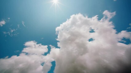 Wall Mural - white cumulus clouds move across the blue summer sky sunny weather.