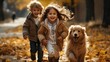 Cute little girl and boy running with their dog along the beautiful autumn park alley. Sister and brother on a walk with their pet. Happy laughing kids playing and having fun with their adored puppy.