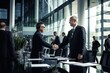 © PHAISITSAWAN - Happy business team shaking hands with clients in the office Smiling executive team making deals with customers and shaking hands at work inside the office conference room.