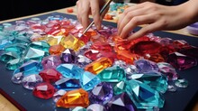 Handmade Creative Process Of Creating And Collecting 3D Painting From Acrylic Multicolored Square Rhinestones