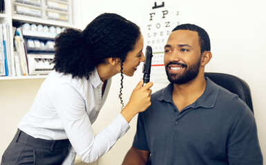 Canvas Print - Patient, eye care and healthcare in clinic with ophthalmoscope to check for glaucoma, ocular services and assessment. Optician, woman and retina analysis for eyesight of happy man with expert tools