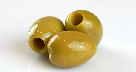 Poster - Green olives on a white background. Close-up footage on the rotating table.