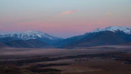 Wall Mural - Soft mountains at sunset. Purple sunset over majestic mountains.