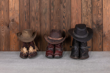 Wall Mural - cowboy hat and boots on wooden floor