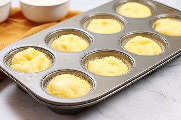 Sticker - a muffin tin filled with unbaked batter