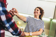 © Mediteraneo - Multiracial couple dancing salsa in the kitchen