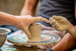 lesson on sculpting a clay cup with your hands on a rotating table