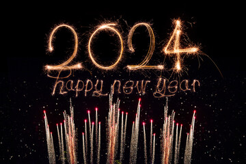 happy new year 2024. sparkling burning text happy new year 2024 isolated on black background.