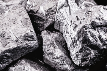 Poster - Raw manganese. Manganese stone isolated on black background.