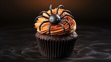 Halloween Themed Baked Goods With Pumpkin Frosting And Spider Embellishment