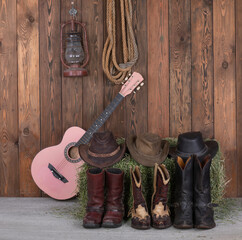 Canvas Print - guitar and cowboy boots in the barn