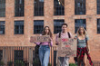 Generation Z activists with banners protesting on the street. Young students marching through the city demonstrate against climate change. Protesters demanding gun control, racial and gender equity.