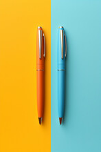 colorful arrangement of ballpoint pens on colored background