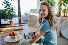 Woman with diabetes using continuous glucose monitor. Diabetic woman connecting CGM to smartphone to monitor her blood sugar levels in real time.