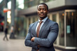 © MaskaRad - an African-American businessman in a suit outside.