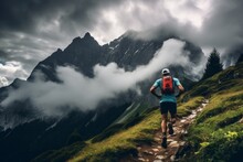 An Ultra Trail Runner Trains In A Beautiful Mountain, With An Incredible Backdrop Of Snowy Peaks. Sports Concept, Trail Running, Hiking.