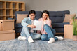 © Prostock-studio - Anxious Korean Young Couple Reviewing Home Loan Documents Papers Indoors