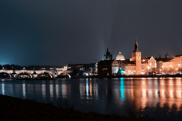 Wall Mural - Prague, view of the Lesser Bridge Tower of Charles Bridge (Karluv Most) at night, Czech Republic.